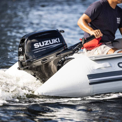 Suzuki 15 HP Black Tiller In Use on Dinghy Side