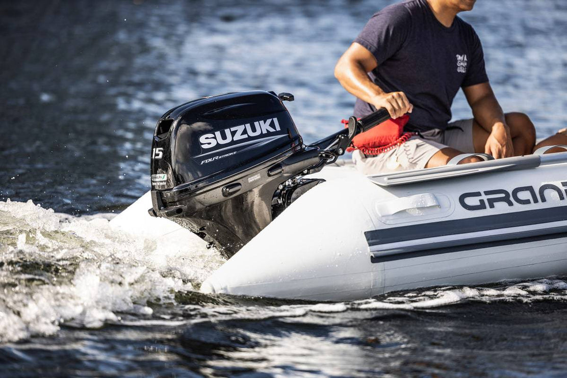 Suzuki 15 HP Black Tiller In Use on Dinghy Side