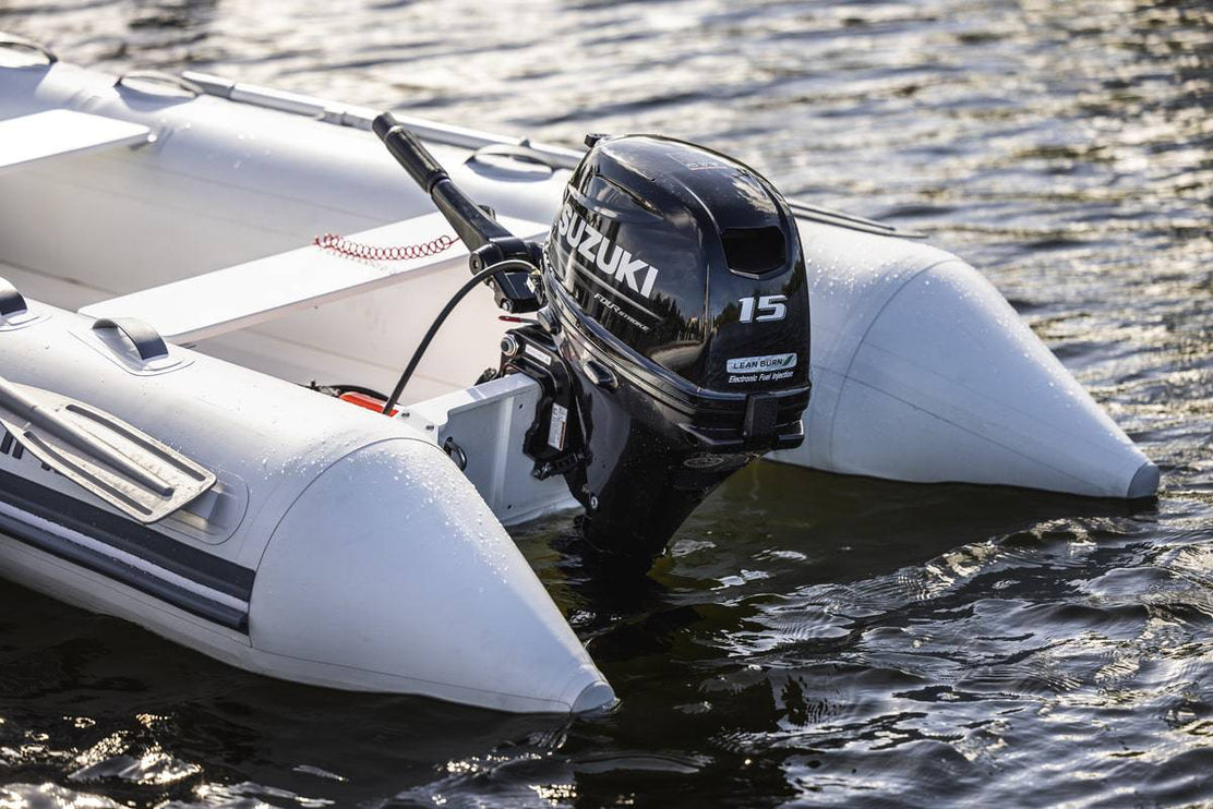 Suzuki 15 HP Black Tiller on Dinghy Diagonal View