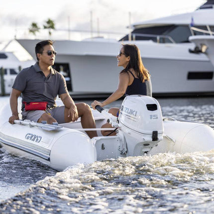 Suzuki 15 HP White Tiller In use On Dinghy Back View