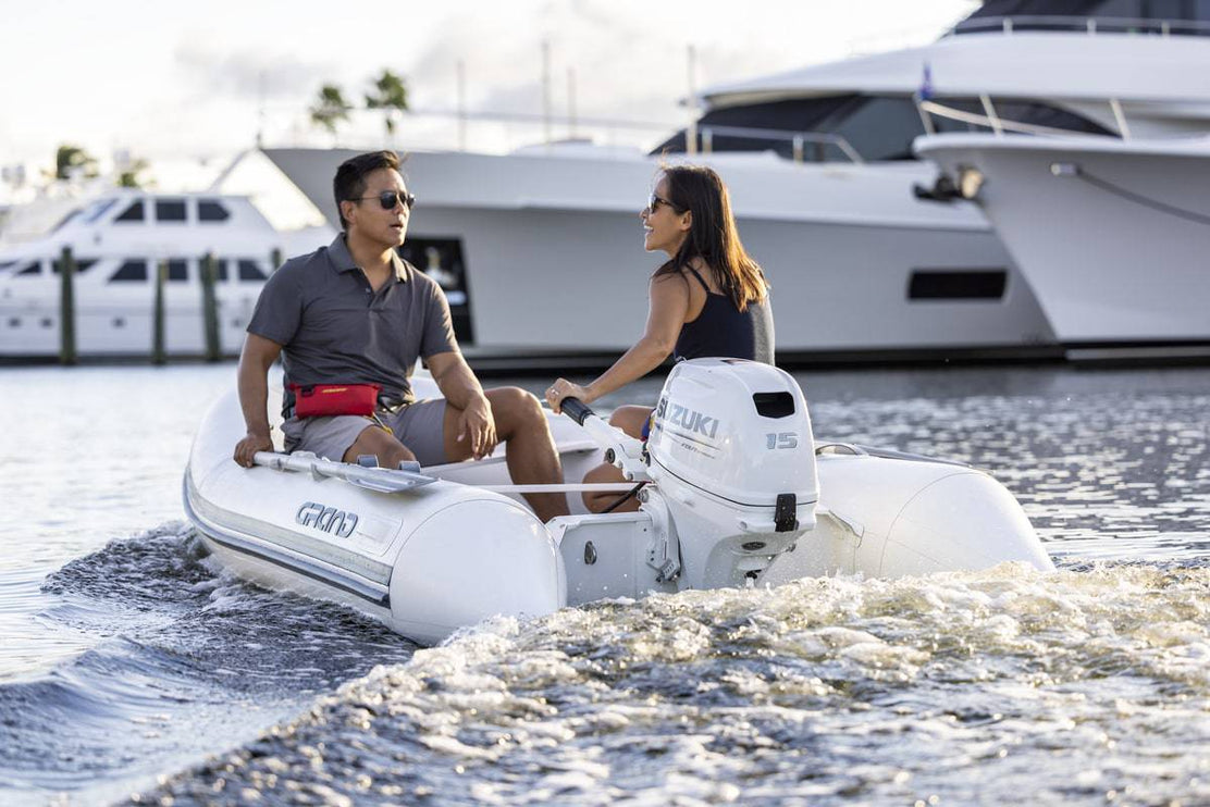 Suzuki 15 HP White Tiller In use On Dinghy Back View