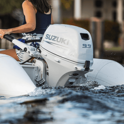 Suzuki 9.9 HP White Tiller in Use on Dinghy