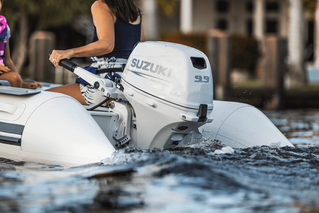 Suzuki 9.9 HP White Tiller in Use on Dinghy